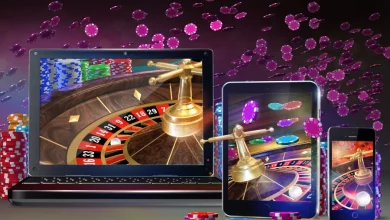 a laptop and tablet with roulette wheel and chips flying